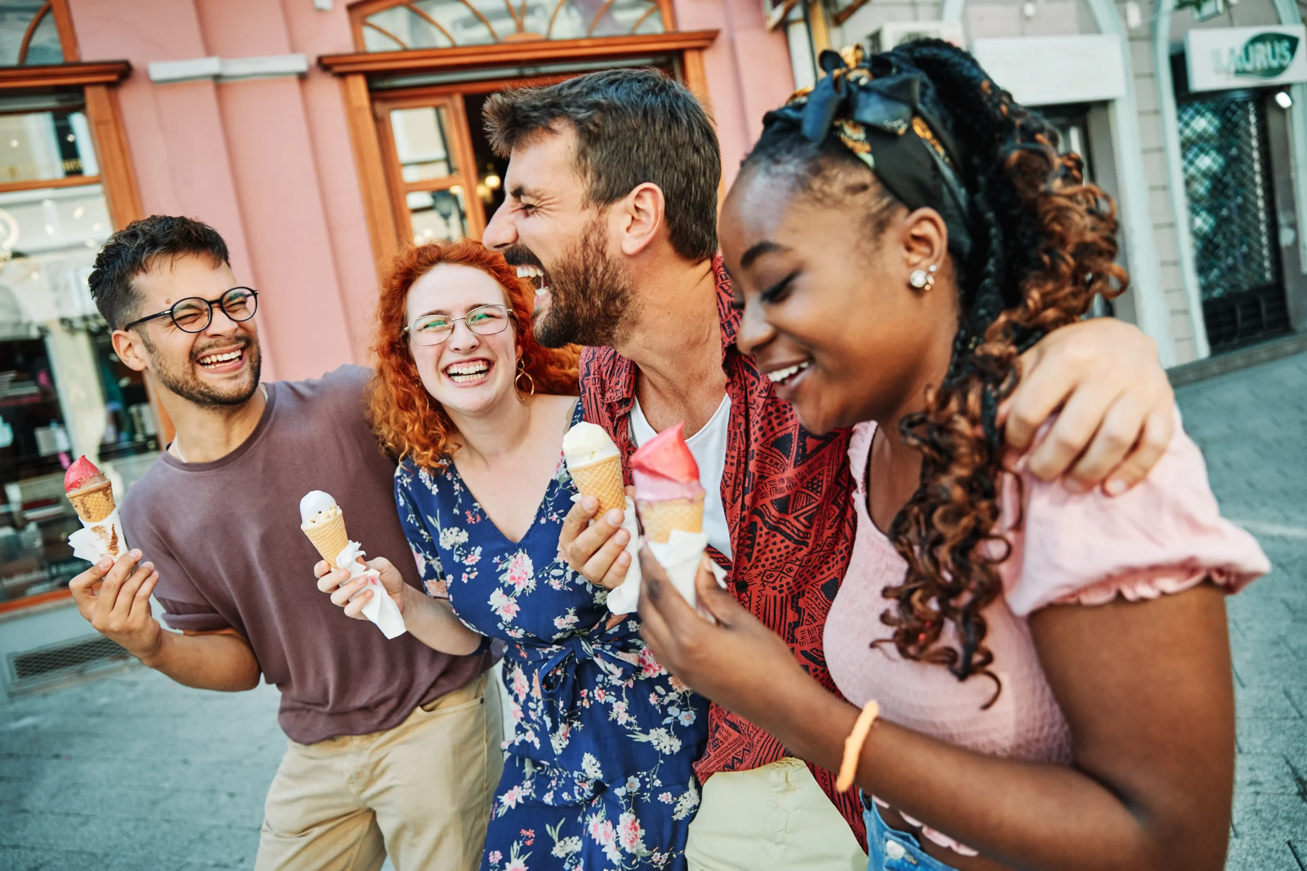 Friends enjoying ice cream together during a public tour